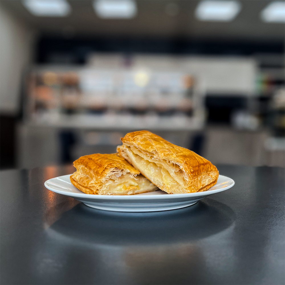 A tempting Cheese and Onion Slice ready to be enjoyed, available for purchase from Bowen Pies, your go-to UK pie company - buy cheese onion slice online and get it delivered straight to your door.
