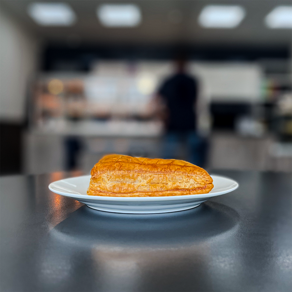 Freshly baked Cheese and Onion Slice from Bowen Pies, featuring golden flaky pastry and a delicious cheddar and onion filling - buy cheese onion slice from a trusted UK pie company with pie delivery