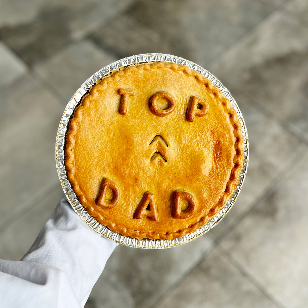 A large father's day pie gift with "top dad" written on it. The best gift for your pie loving dad.