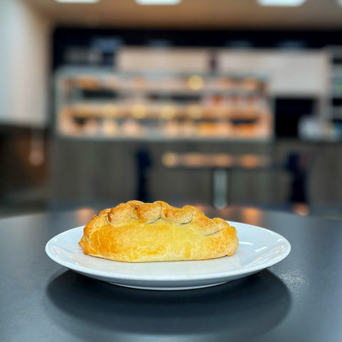 Close-up of Bowen Pies' Traditional Pasty with a golden, flaky crust, one of the best pies in the UK. Perfect for pasty lovers.