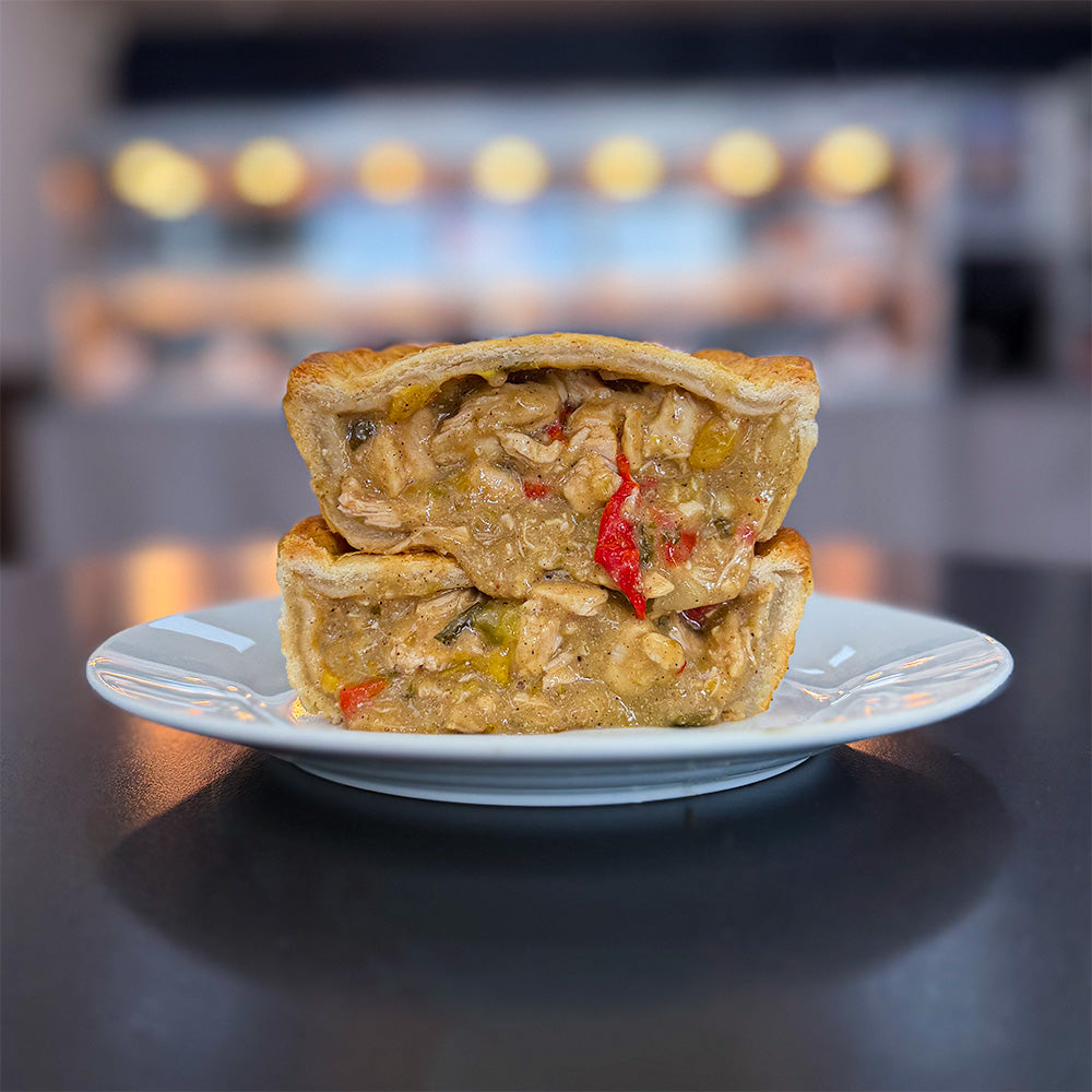 Jamaican jerk chicken pie cut in half
